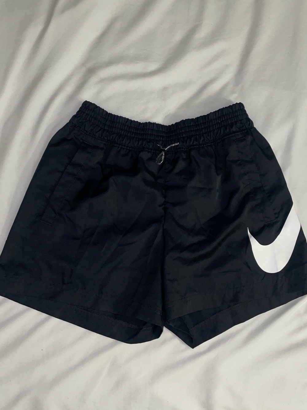 Nike Women’s Black Athletic Shorts with White Swoosh Accent